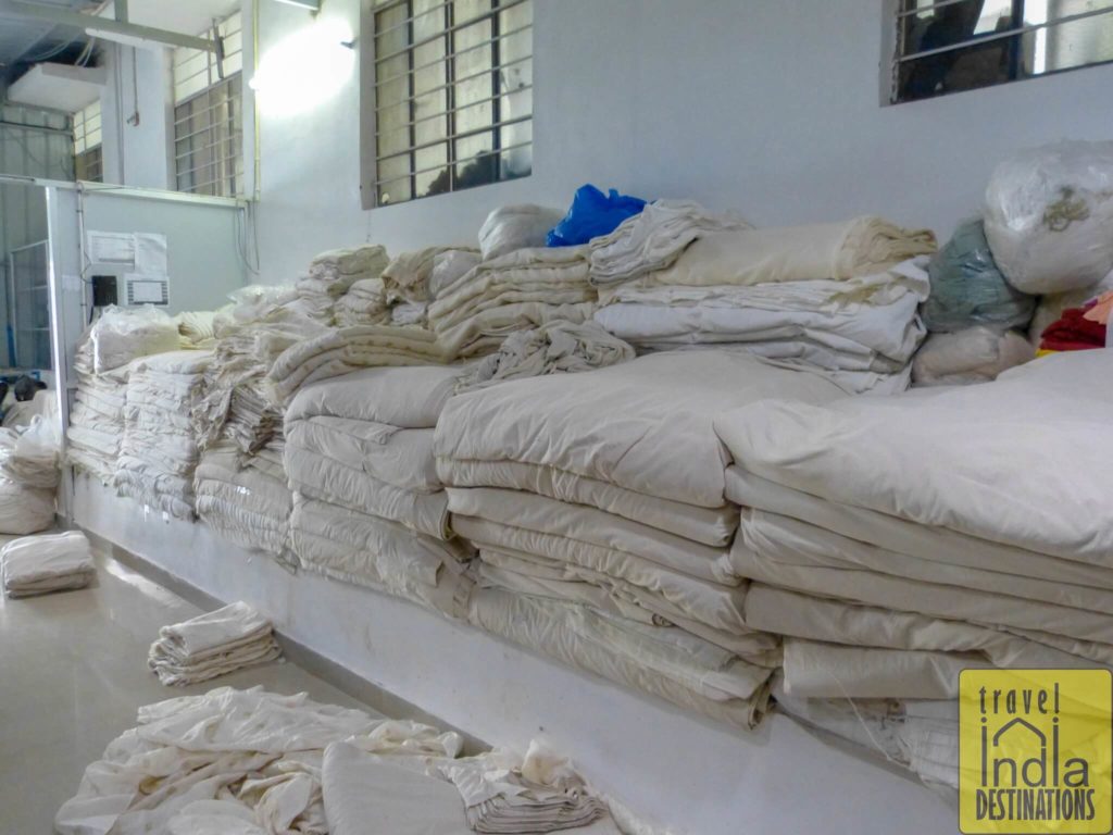 bundles of plain cloth at daboo printing facility