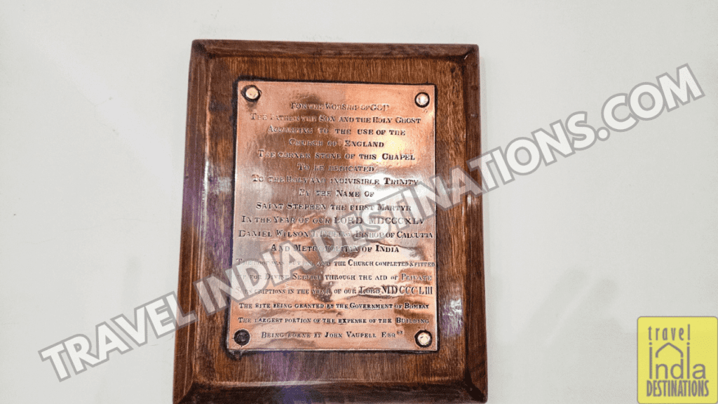 The plaque that tells about the extension of the church from a chapel