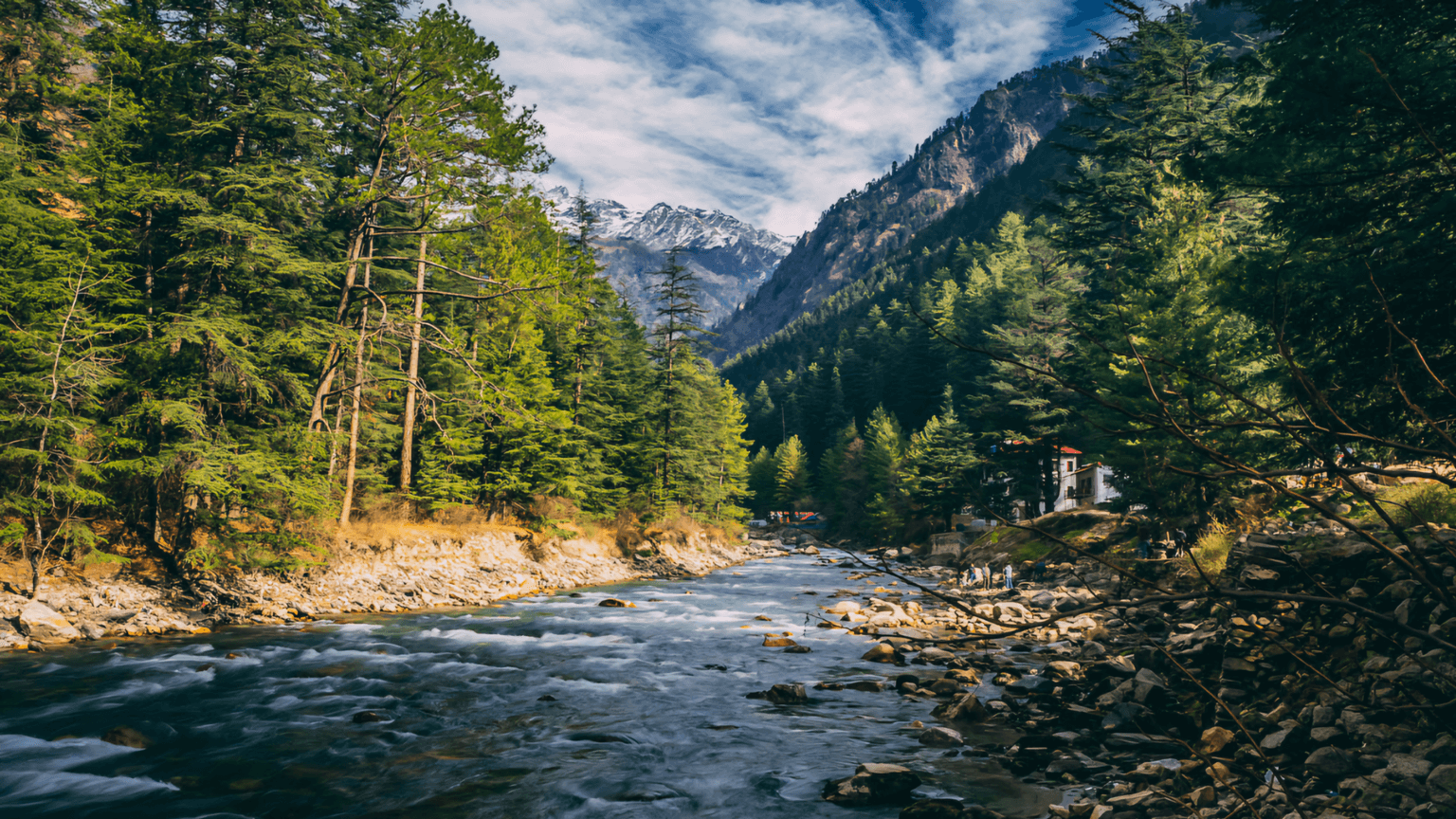 A river flowing through Kasol mountains