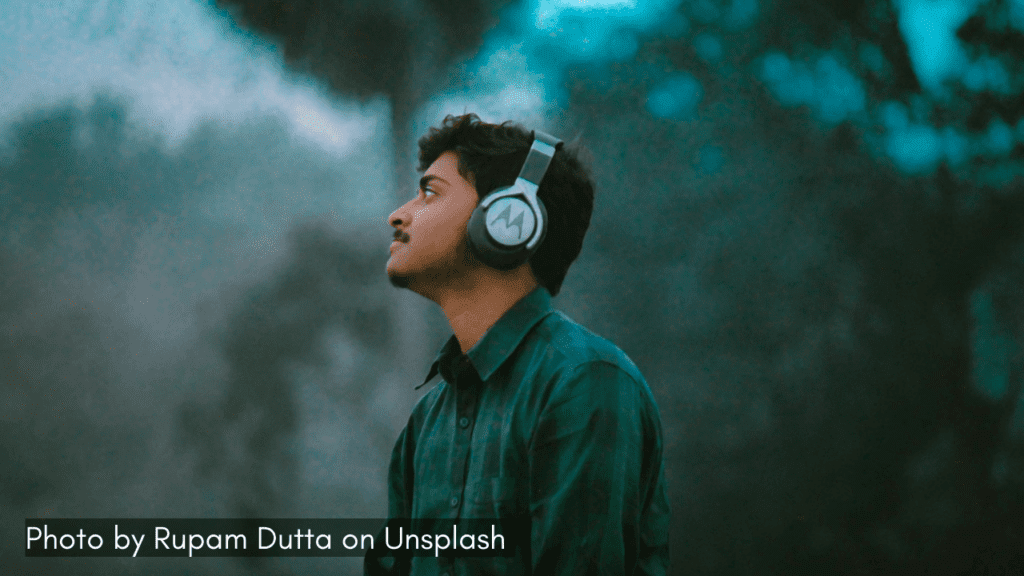 A man enjoy a rainy day listening to music