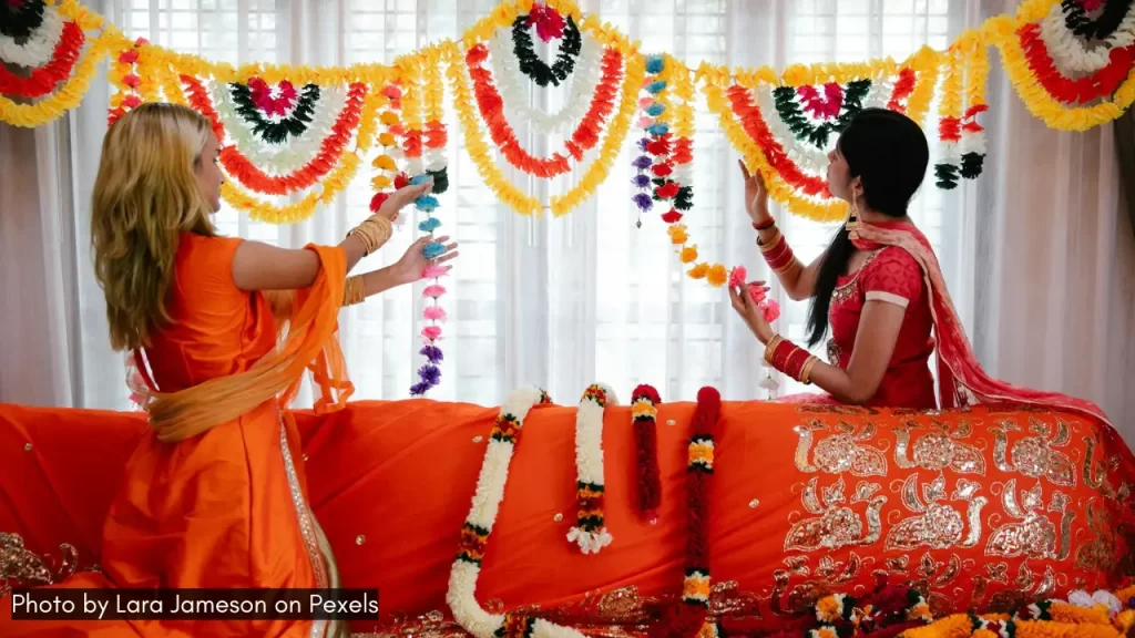 two girls decorating to celebrate navratri at home with new theme