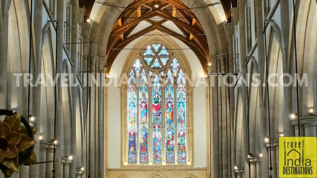 a view of the stained glass above the altar from the main door of the afghan church