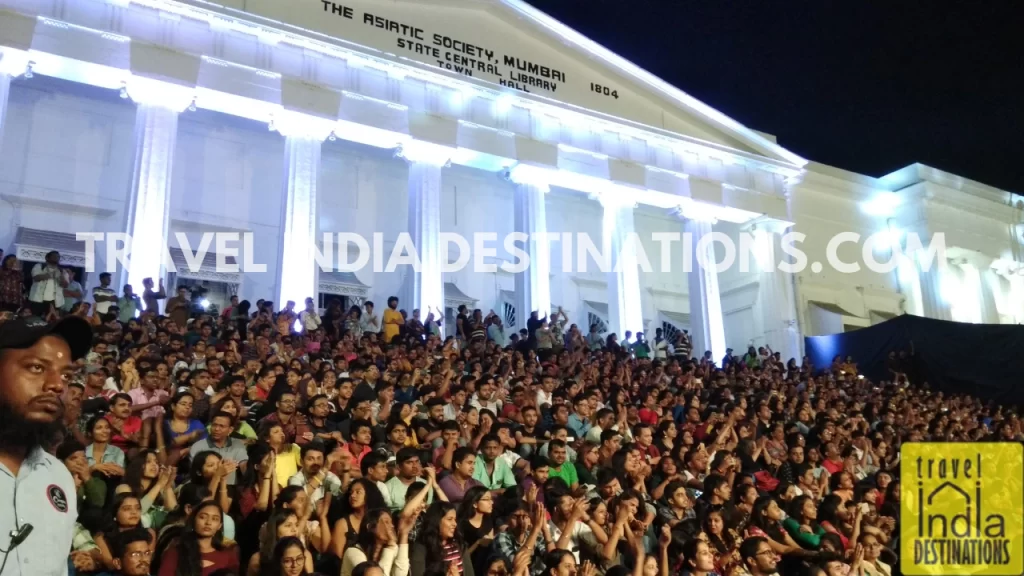 crowds at the asiatic library steps watching music performances