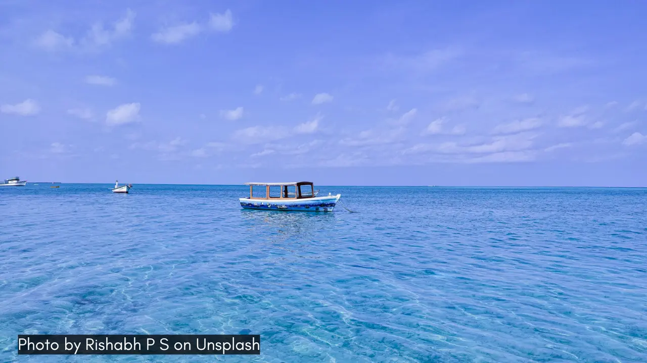 a boat in the azure blue waters of lakshadweep islands