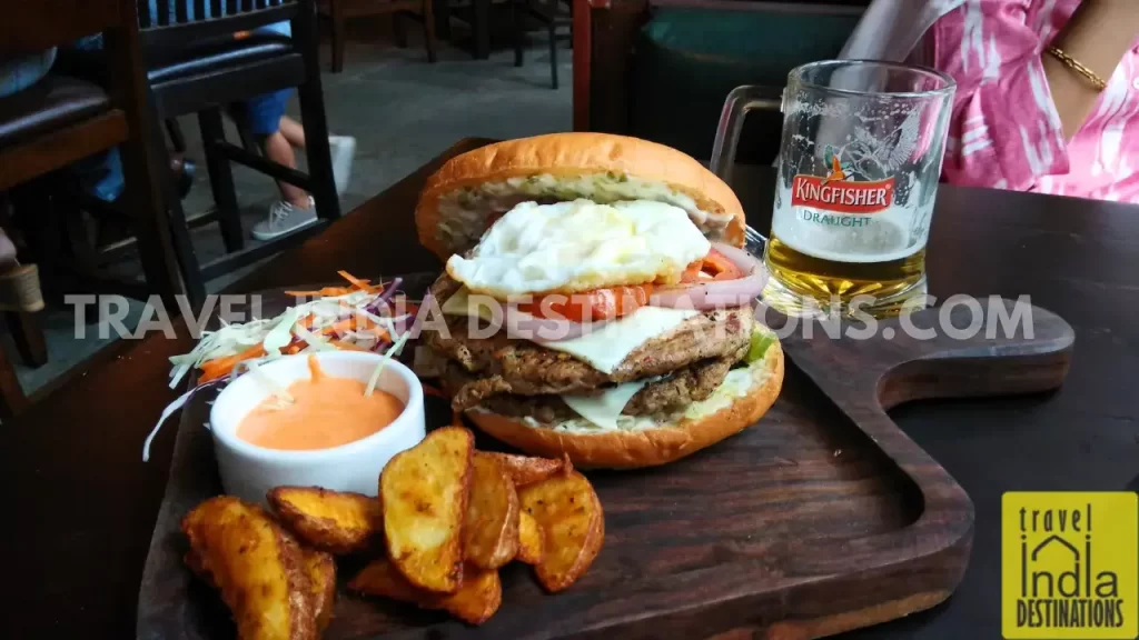 burger, wedges and a glass of beer at British Brewing Company in Mumbai