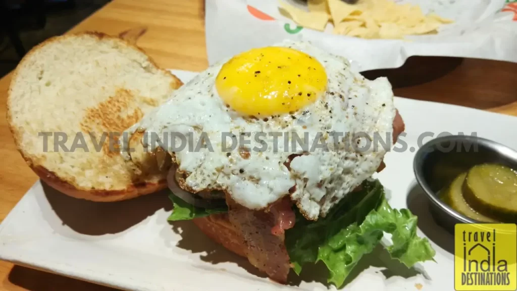 a fried egg on a burger at Chili's Powai in Mumbai