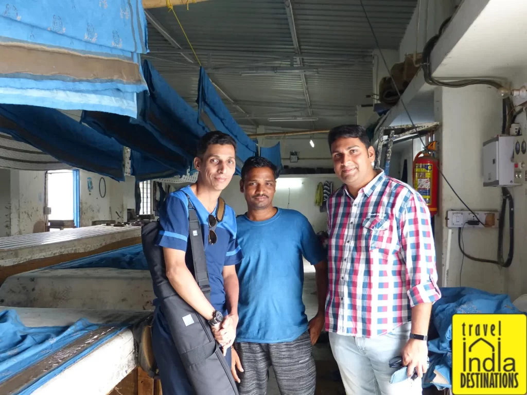 Sharukh with artisans at a Daboo printing workshop in Udaipur, Rajasthan.