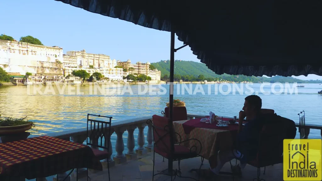 a view of Pichola Lake in Udaipur from Ambrai Ghat overlooking the City Palace