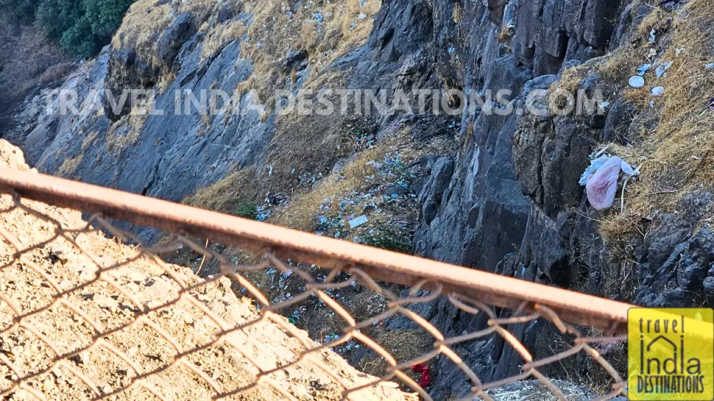 A heap of litter thrown from above scattered all over the valley below at Tiger Point