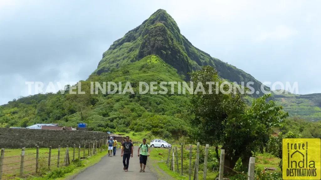 Rear view of Visapur Fort showing its triangular mountain-like structure, captured en route to Lohagad Fort.