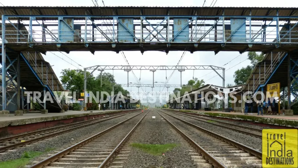 View of Malavli Station, showing the empty train station and surrounding landscape.