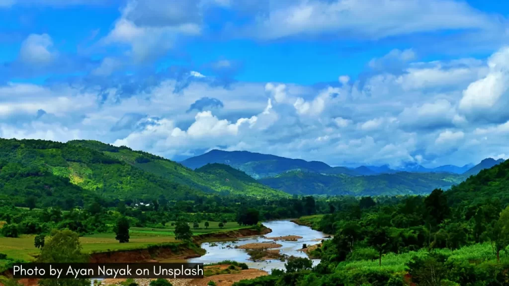 A panoramic view of the river and surrounding hills in Daringbadi in Odisha one of the best places to visit in July in India