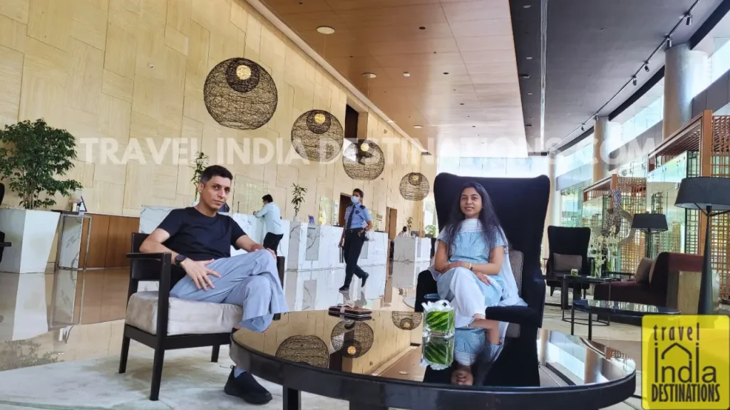 Couple enjoying conversation in the reception area of Westin Mumbai Garden City.
