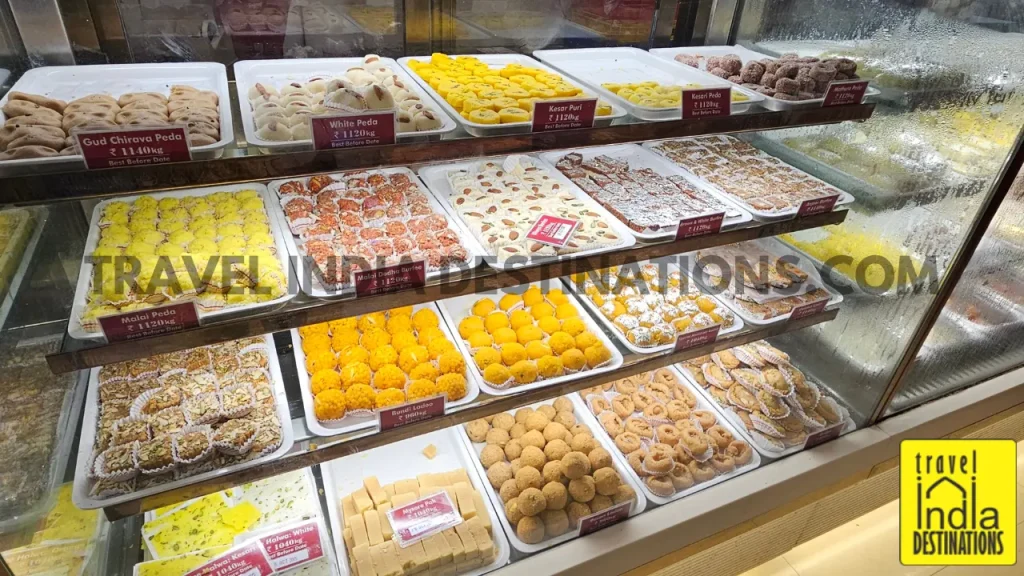 Interior of Brijwasi store in Mumbai showing colorful mithai and Indian sweets on display, perfect for Diwali, weddings, and festive celebrations.