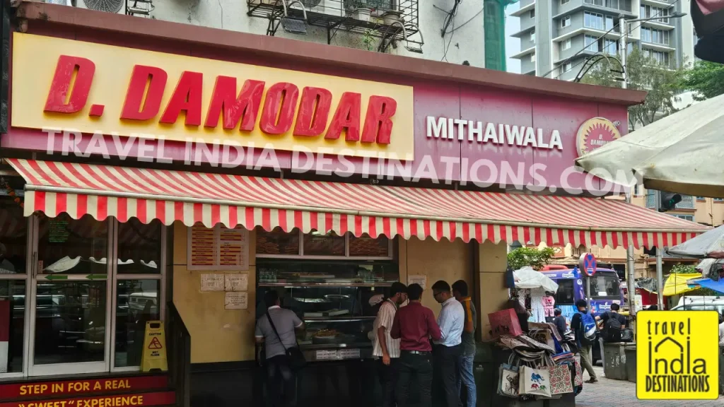 Exterior of D. Damodar Mithaiwala sweet shop in Mumbai, a popular destination for traditional Indian mithai and festive sweets.