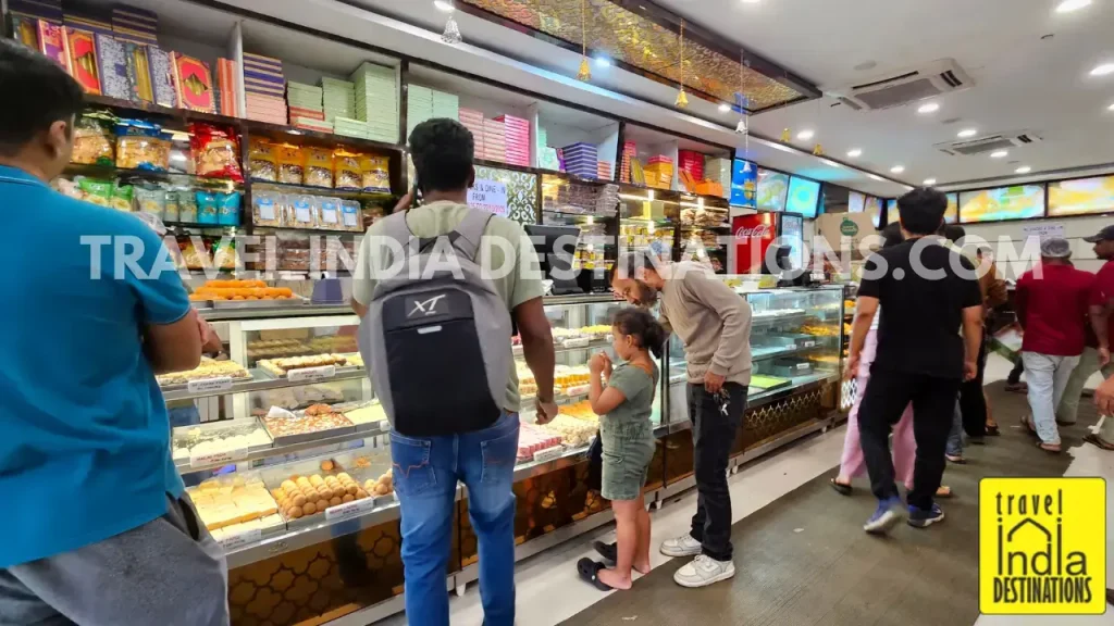 Interior of Gulatis sweet shop in Mumbai showing colorful mithai and Indian sweets on display, perfect for Diwali, weddings, and festive celebrations.