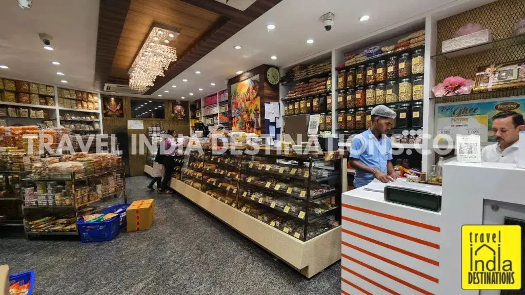 Interior of Hariom Sweets in Mumbai showing colourful mithai and Indian sweets and snacks on display, perfect for Diwali, weddings, and festive celebrations.