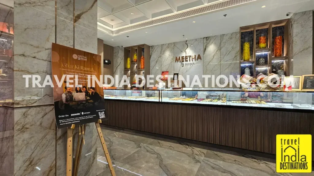 Interior of Meetha by Radisson in Mumbai showing colorful mithai and Indian sweets on display, perfect for Diwali, weddings, and festive celebrations.