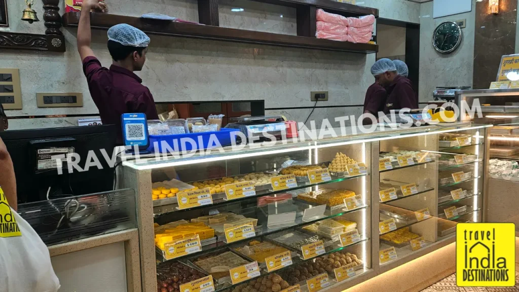 Interior of Panshikar Mithaiwale in Mumbai showing colorful mithai and Indian sweets on display, perfect for Diwali, weddings, and festive celebrations.