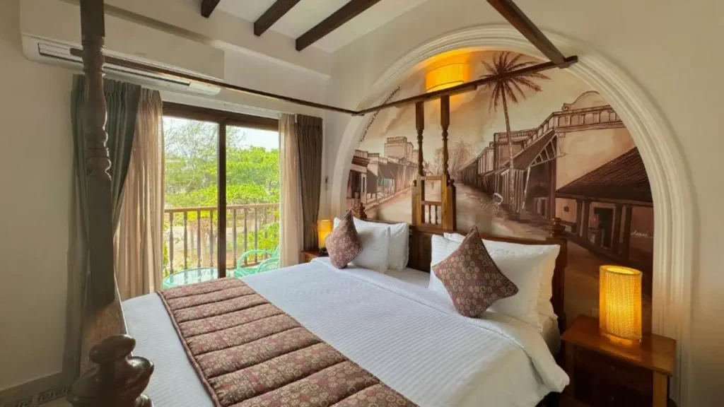 A classic heritage style bedroom at La Plage Seaview Suites one of the best beach hotels in Pondicherry.