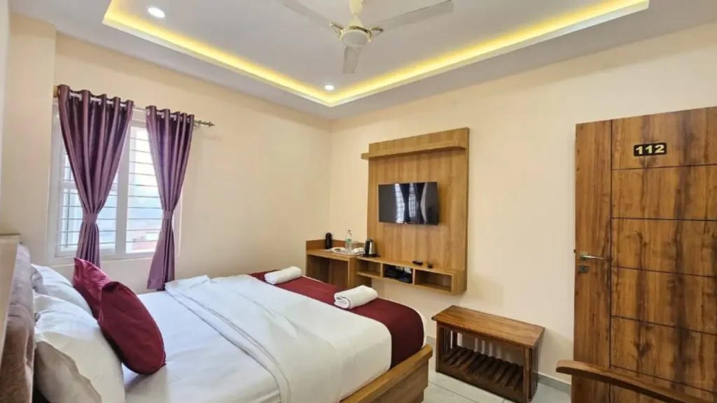 A shot of Deluxe Double Room at Navarathna Comforts one of the best Madikeri budget hotels.