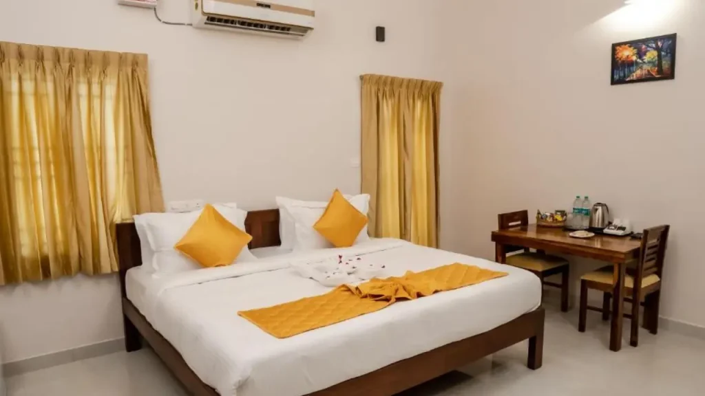 Interior view of a simple heritage room at Palais de Pondichéry, Pondicherry, one of the budget hotels near beach.