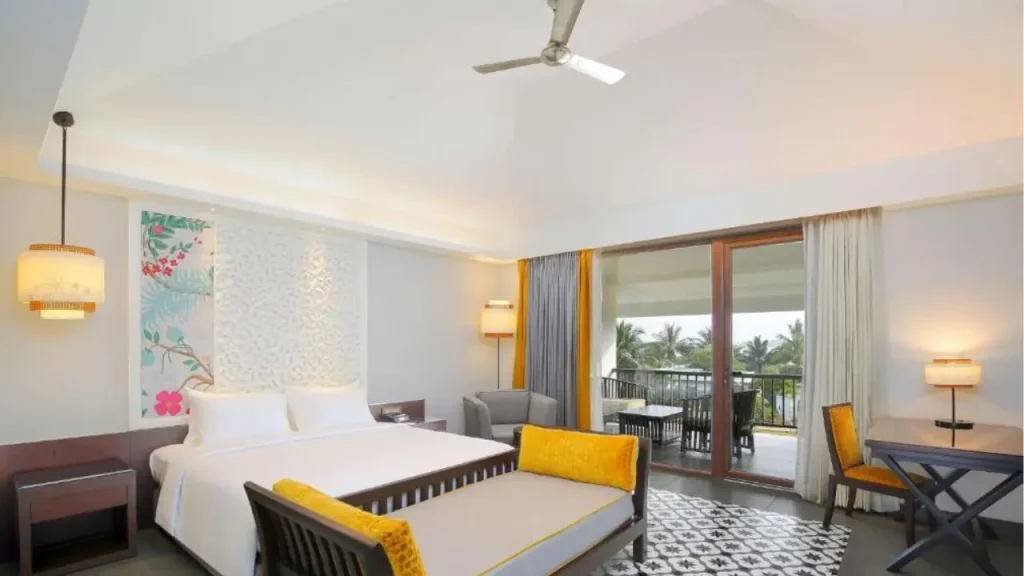 A shot of the interiors of Chalet with balcony and garden at Radisson Resort Pondicherry one of the luxurious hotels near Pondicherry Beach.