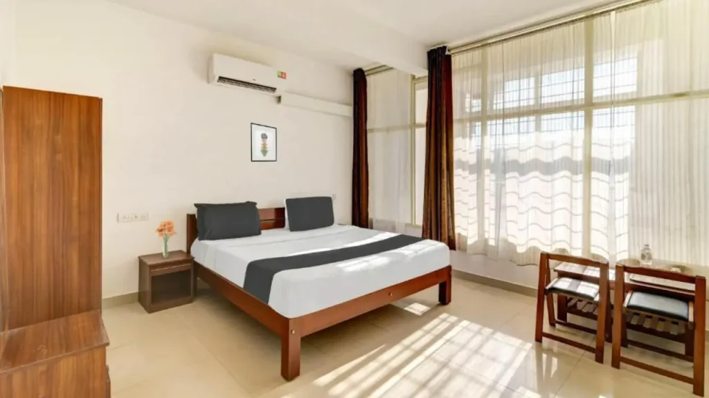 Cozy interiors of Super Collection O in Coorg, one of the best affordable hotels in Madikeri.
