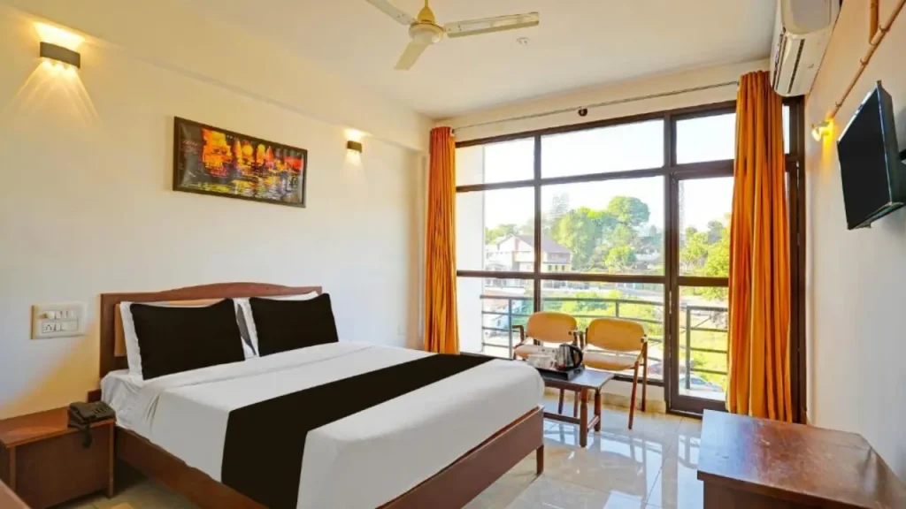 A view of the Classic Triple Room in Super Townhouse near Madikeri Fort, one of the best budget hotels in Coorg.
