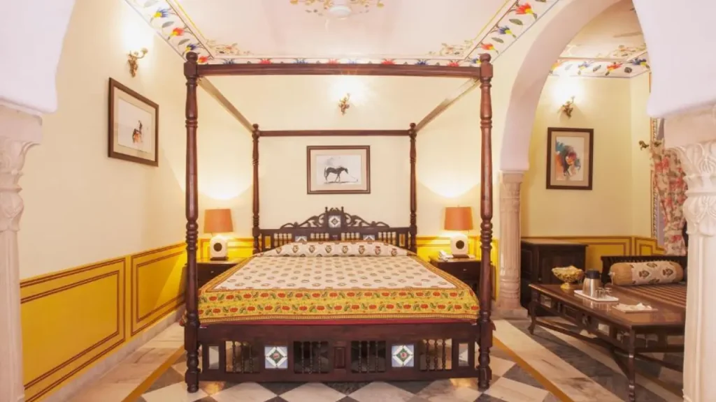 Cozy interiors of the Royal Chamber at Hotel Bissau Palace, one of the budget havelis and heritage properties in Jaipur.