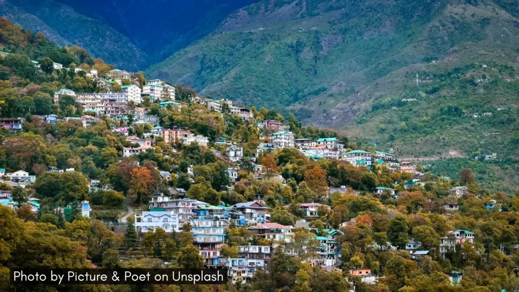 A scenic shot of lush mountains of Dharamshala in Himachal Pradesh, one of the best minimoon destinations in April in India.