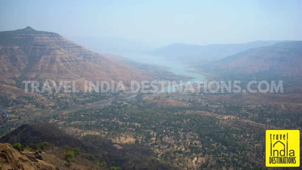 A scenic hazy view of the Dhom Lake from Kate's Point in Mahabaleshwar.