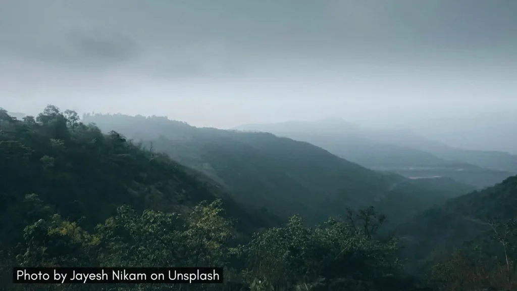 A panoramic shot of Kasara Ghat with haze during the monsoon season, ideal for monsoon road trip from Mumbai.