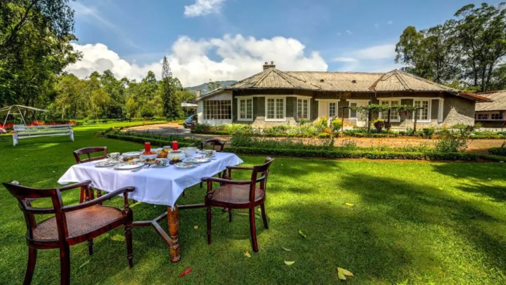 Exteriors of the Lockhart luxury bungalow with spacious garden and outdoor dining for minimoon in May in India.