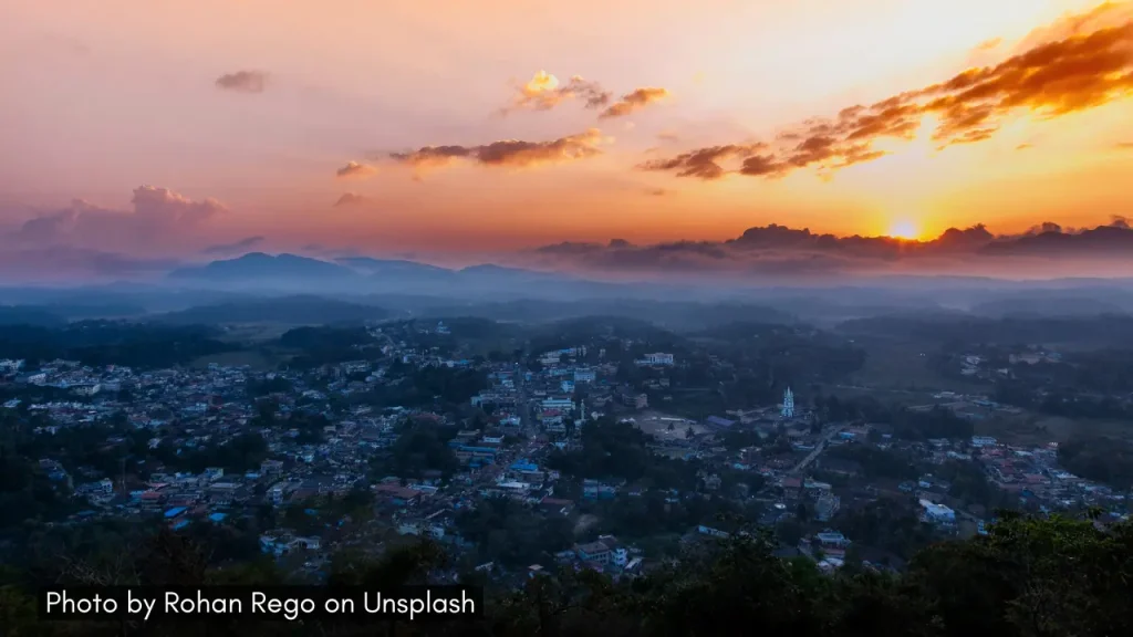A panoramic view of sunset over the town of Virajpet in South Coorg ideal for those who want immersive holiday experiences.