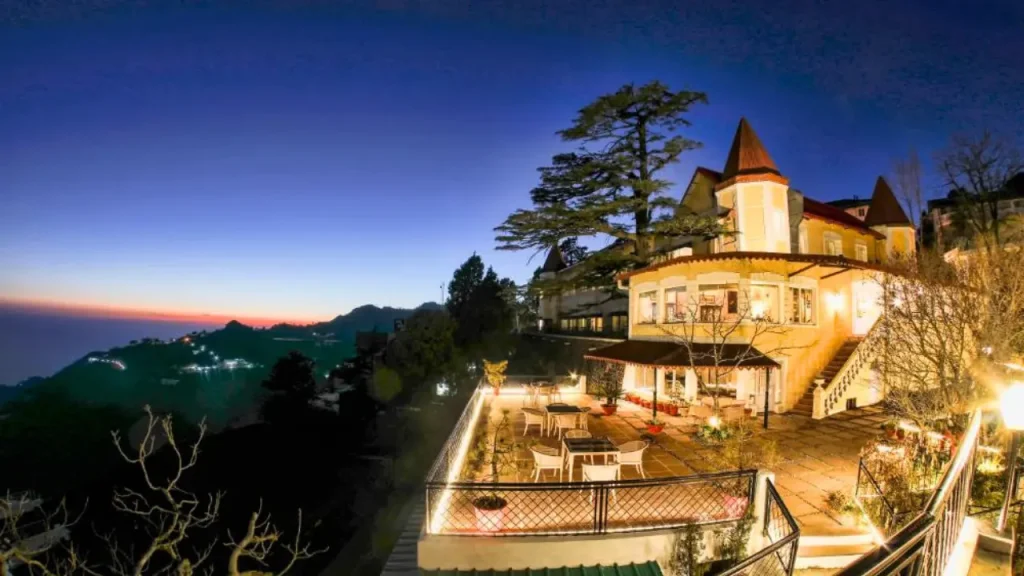 Exteriors of the WelcomHeritage Kasamanda Palace in Mussoorie overlooking the valley and sunset views.