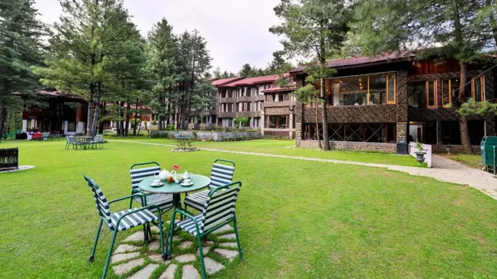 Open garden and sitting area of WelcomHotel by ITC, Pine N Peak in Pahalgam for minimoon in June.