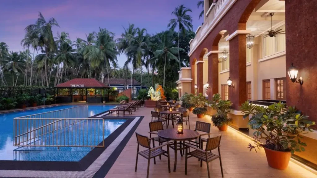 Outdoor seating and swimming pool area at the Fairfield by Marriott, one of the best family hotels in Goa in Calangute.