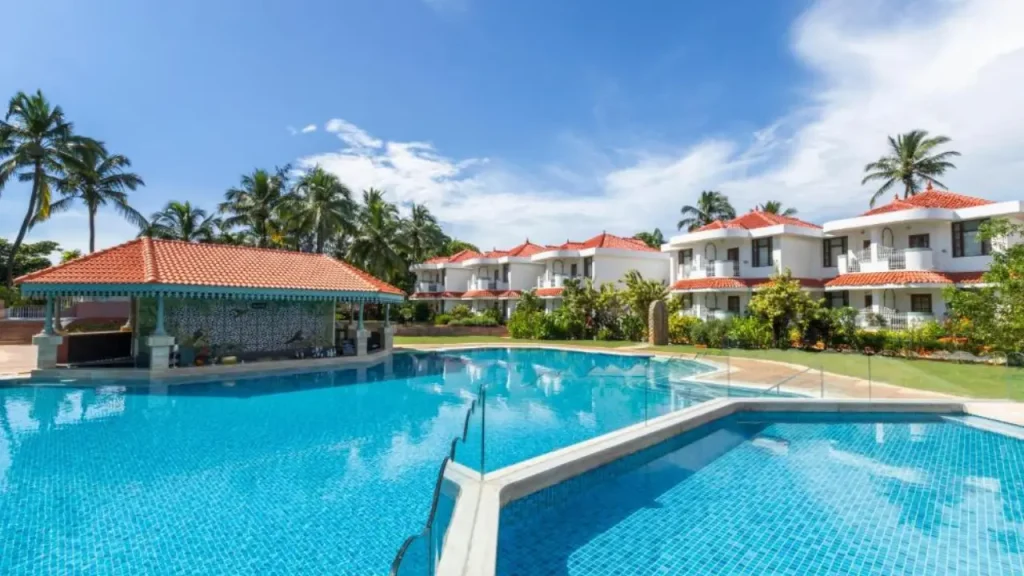 Outdoor swimming pool area at the Heritage Village Family Resort & Spa one of the best family resorts in Goa.