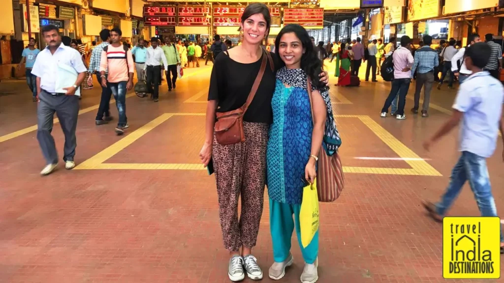 Sarah and Iris standing outside Chhatrapati Shivaji Maharaj Terminus (CSMT) in Mumbai.