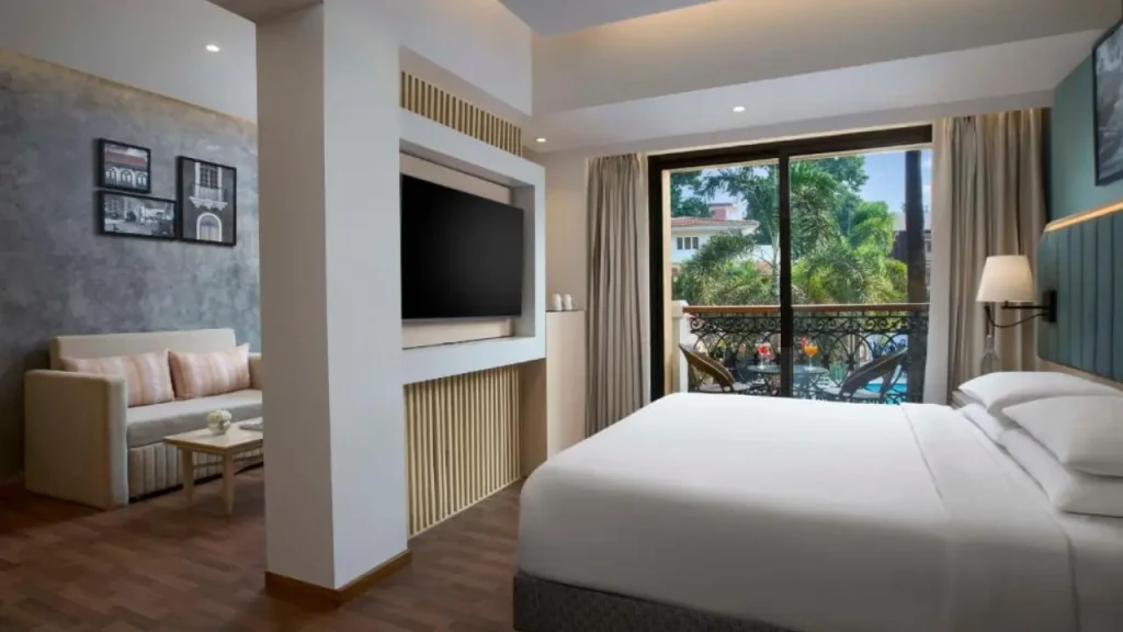 Cozy interiors of Junior Suite with Pool View at Park Inn by Radisson, one of the best affordable family hotels in Goa.