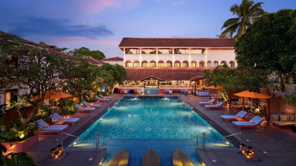 A shot of outdoor swimming pool at Ronil Goa, Part of Hyatt, one of the best affordable hotels for couples in Goa.