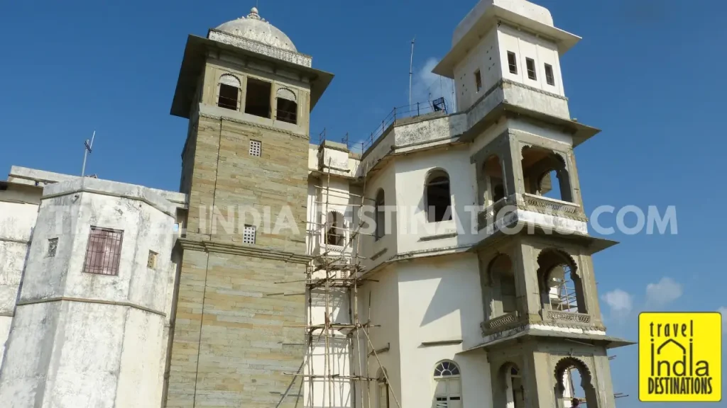 A shot of the rear (West) side of the Sajjangarh Monsoon Palace in Udaipur with intricate balconies and windows.