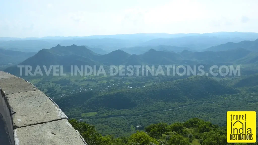 A view of the sun setting in the west with lush Aravalli Hills as seen from Sajjangarh Monsoon Palace in Udaipur.