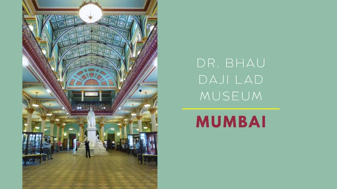 Dr. Bhau Daji Lad Museum main hall with arched ceiling, pillars, chandeliers and glass display cabinets