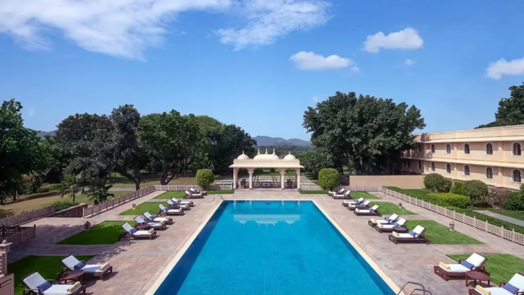 A shot of the outdoor swimming pool at the Trident, one of the best family hotels in Udaipur.