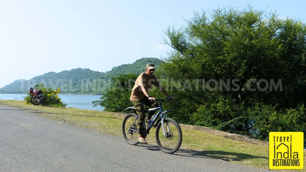 A man bicycling at Badi Lake in Udaipur, one of the recreational activities in the city.
