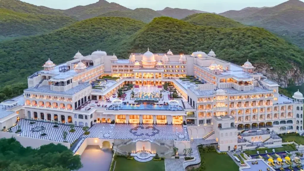 An overview of the Fairmont Udaipur Palace, one of the best luxury hotels in Udaipur with modern amenities with Aravali hills in the backdrop.