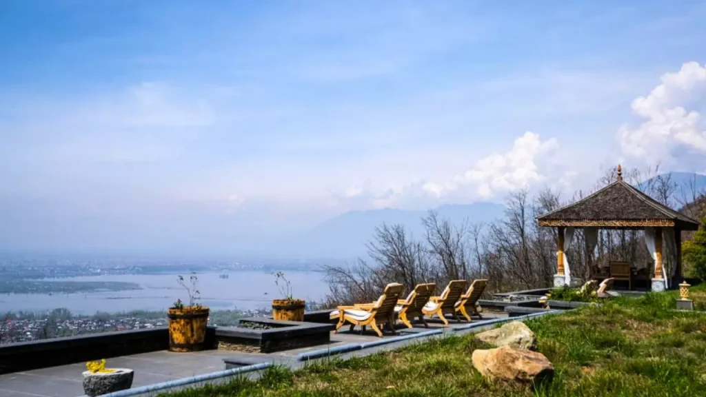 A shot of a gazebo and sunlounges at Qayaam Gah hotel in Srinagar, Kashmir overlooking the Dal Lake.