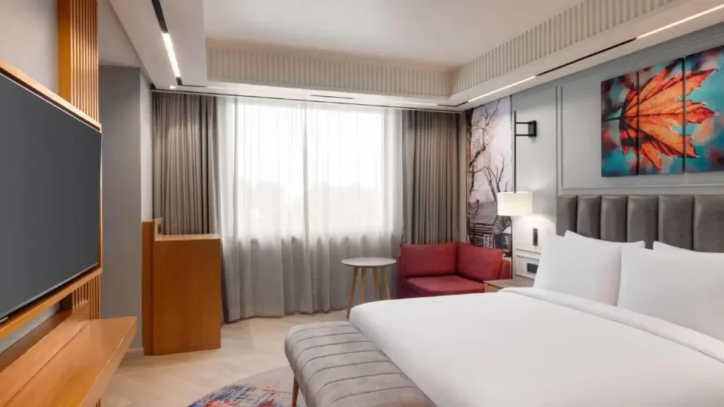 Cozy interiors of one of the rooms at Ramada Encore Wyndham Raj Bagh hotel in Srinagar, Kashmir.